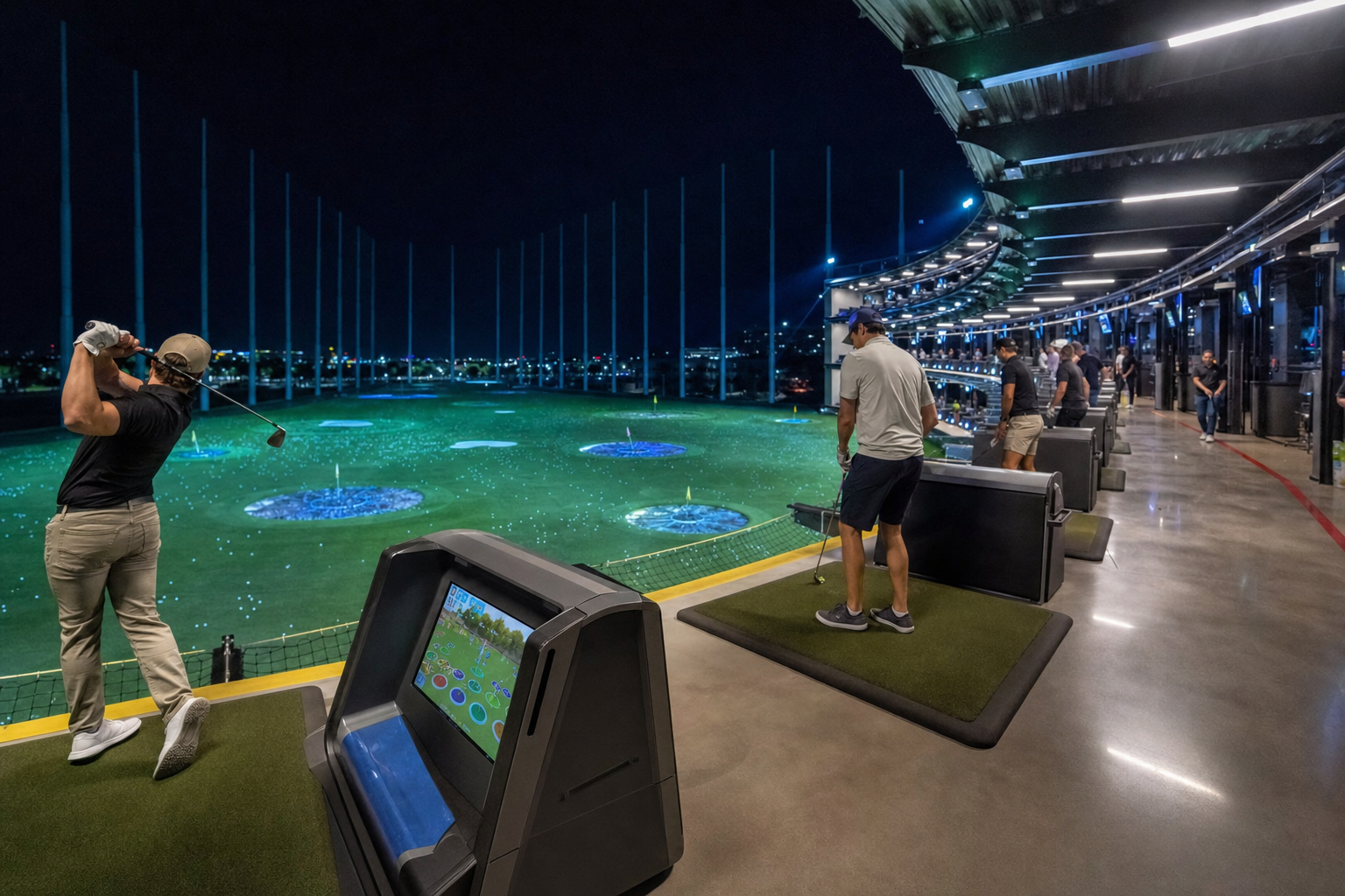 Inside a covered, heated bay — illustrative; a real photo would show a Toptracer screen, hitting mat and seating for a group