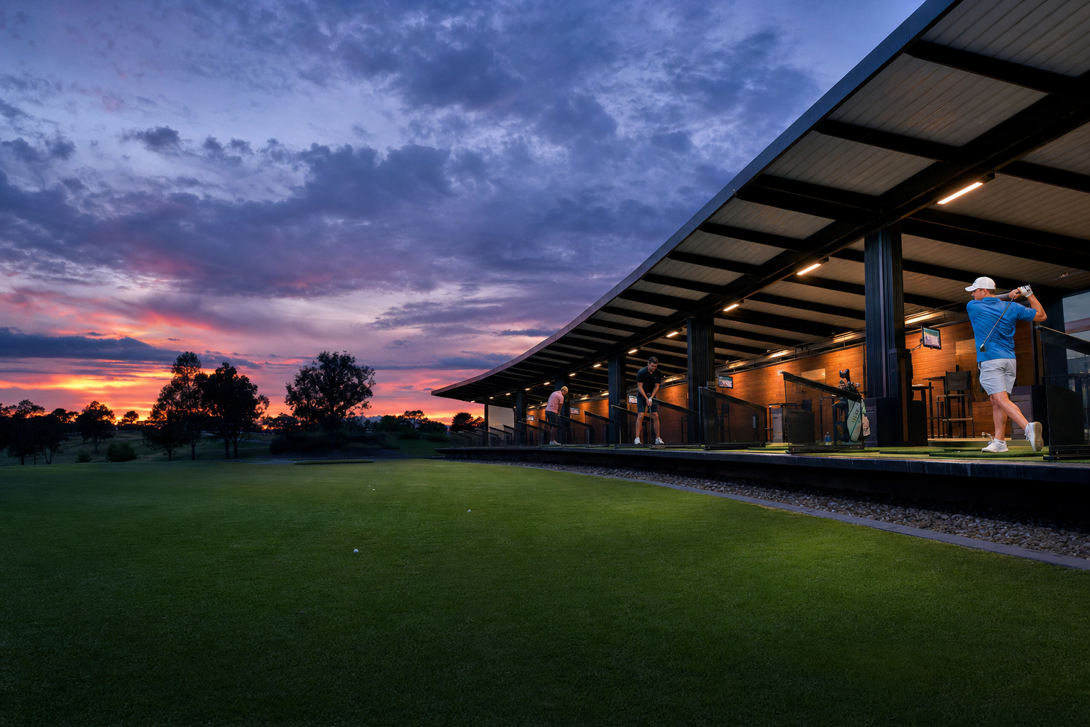 The range lit up at night — illustrative; a real photo would show the full sweep of floodlit bays seen from the car park